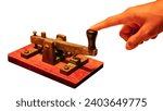 Close up of a telegraph key being used by an operator to make morse code and communicate, isolate on white background.