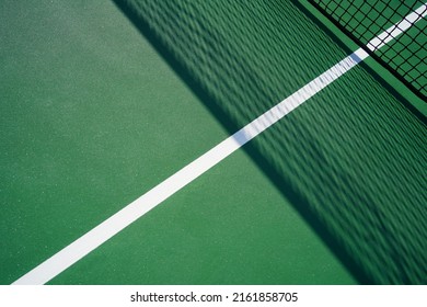 Close Up Of A Tennis Court With Net Shadow.                           