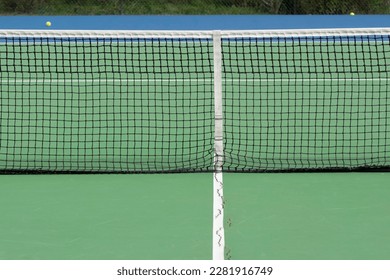 Close Up Tennis Net With Broken Floor  