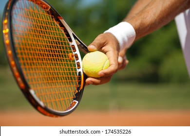 Close up of a tennis player standing ready for a serve