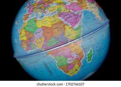 Close Up Of Terrestrial Globe With Focus On Europe, North Africa And Middle East On Black Background.