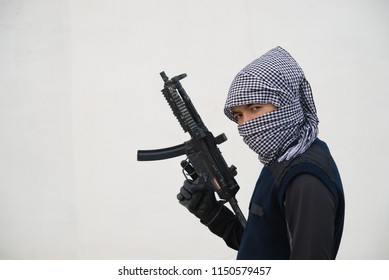 Close Up Terrorist With Gun On White Background,Thailand People,A Bad Guy,He Is No Good Man