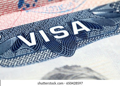 Close up of text VISA on USA visa stamp in passport
 - Shutterstock ID 650428597