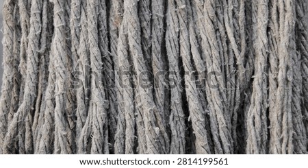 Close up texture background of grey cotton mop fibers