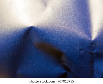 Close Up Texture Of Blue Metal Crisp Packet; England; UK