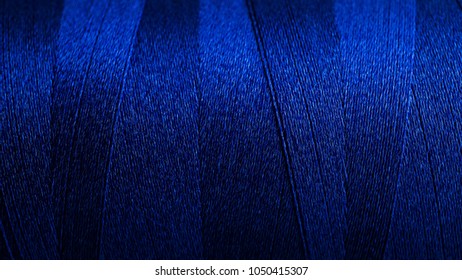 Close up texture of blue thread background, macro picture