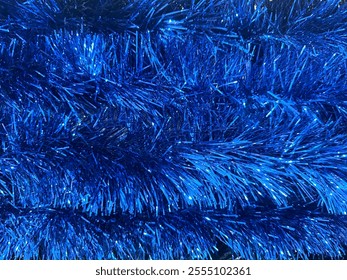 Close up texture of christmas slingers or tinsels in various colors. Made of many materials, tinsels are often used to decorate christmas tree or rooms similar to icicle effects. - Powered by Shutterstock