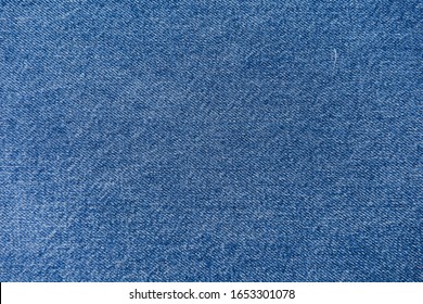 Close up Texture of denim or blue jeans background
