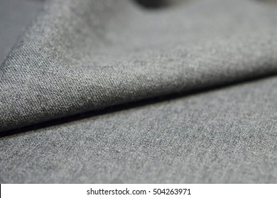 close up texture light gray fabric of suit, photo shoot by depth of field for object