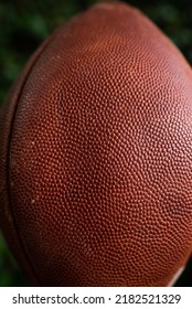 Close Up Texture Of An Old Weathered Pigskin Football.