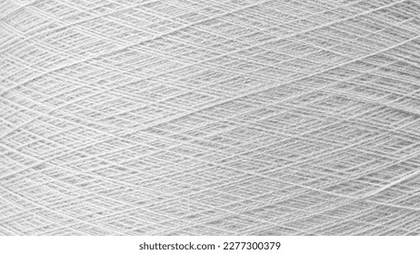 Close up texture picture of sew thread spool gray silver color, macro background