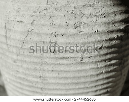 Close Up Texture of Rustic Gray Handmade Ceramic Pot with Ribbed Surface — Artisan Craft Detail