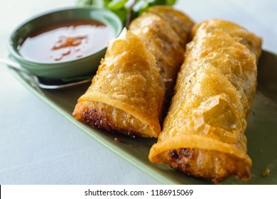 Close Up Thai Fried Springroll And Sweet Chilli Dip On Green Ceramic Plate