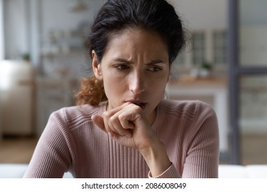 Close up thoughtful upset woman thinking about problems sitting alone, pensive unhappy frustrated young female lost in thoughts, feeling lonely and depressed, suffering from divorce or break up
