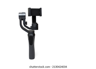 Close up of three axis stabilized motorized gimbal for creating shake free professional epic movie footage with action cams compact cameras and phones on a white background