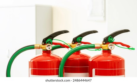 Close up of three manual chemical fire extinguishers. Periodic inspections and maintenance of fire protection systems for safety. Occupational risk prevention. OSHA. Copy space.
 - Powered by Shutterstock