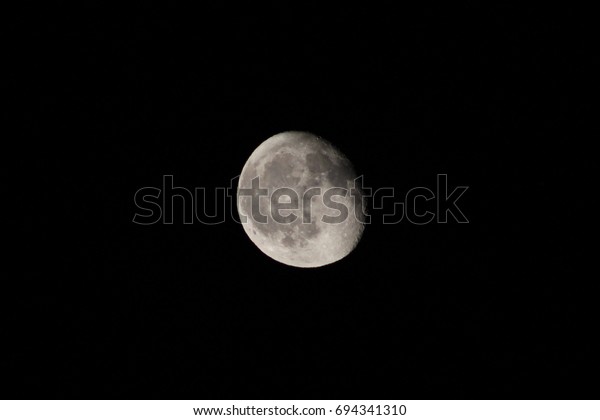 Close up of three quarter moon\
