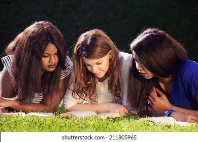Close up of three young girls studying for exams
