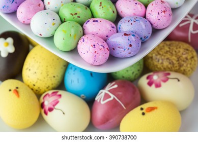 Close Up Of Tiered Server Tray With Assorted Chocolate Easter Eggs.