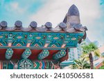 Close up of tile roof and Dancheong of the fortress of Gyeongbokgung Palace, Seoul, South Korea. Details of the Korean traditional Palace roofs on a sunny day. Beautiful korean style wallpaper.