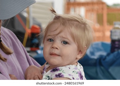 Up close, toddler girl, blonde hair, blue eyes, summer.  - Powered by Shutterstock