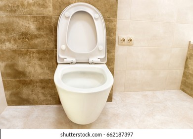 Close Up Of Toilet Bathroom Interior With White Ceramic Seat