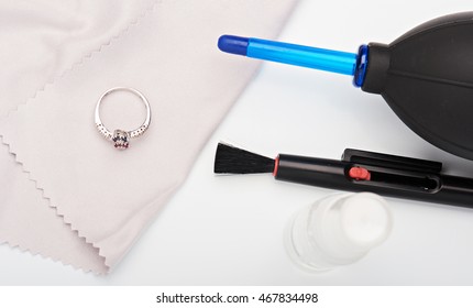 Close Up Tools For Cleaning Jewellery On White Table