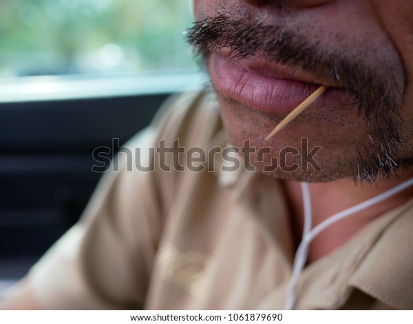 toothpick in mouth
