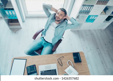 Close Up Top Above High Angle View Photo Handsome He Him His Free Minute Hands Arms Behind Head Nap Overjoyed Refreshment Notebook Table Sit Office Chair Wear Formal Wear Jacket Blazer Jeans Denim