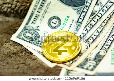 Close up of top important cryptocurrencies which dollar bank note in background. which including of Bitcoin, Ethereum, Litecoin, Dash, Zcash and Ripple coin. Business and financial as concept.