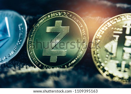 Close up of top important cryptocurrencies which dollar bank note in background. which including of Bitcoin, Ethereum, Litecoin, Dash, Zcash and Ripple coin. Business and financial as concept.