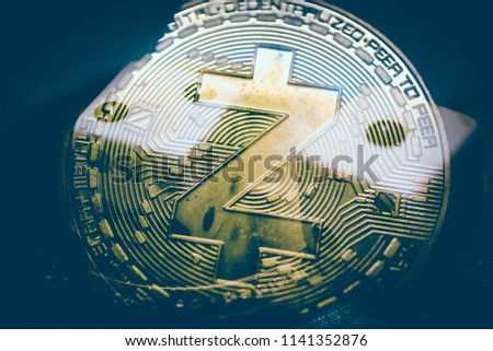 Close up of top important cryptocurrencies which dollar bank note in background. which including of Bitcoin, Ethereum, Litecoin, Dash, Zcash and Ripple coin. Business and financial of cryptocurrency.