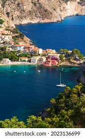 Close up top view at Asos village, Assos peninsula and fantastic blue Ionian Sea water. Aerial view, summer scenery of famous and extremely popular travel destination in Cephalonia, Greece, Europe.
