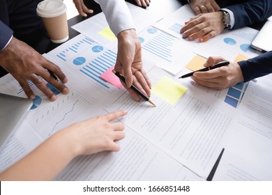 Close Up Top View Of Diverse Businesspeople Cooperate Work Together Discussing Company Financial Statistics, Multiracial Colleagues Employees Collaborate Brainstorm With Finance Document At Meeting