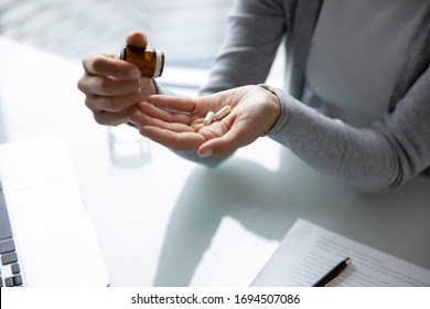 Close Up Top View Of Female Employee Take Daily Dosage Of Prescribed Vitamins Or Medication At Work, Unhealthy Woman Worker Having Antibiotics Or Antidepressant Pill Feeling Sick Unwell At Workplace