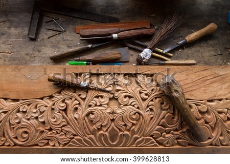 Close up top view set of carpenters tool on the hand made engraving, carving wood