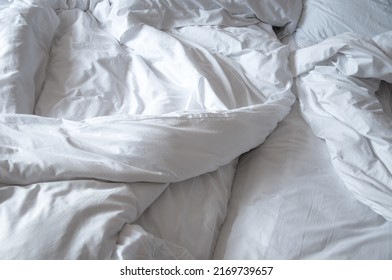 Close Up Top View Of White Wrinkle Messy Blanket On Bed In Bedroom, From Sleeping In A Long Night, Duvet , Morning Time On Bed