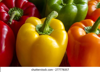 Close up of tops of assorted colorful bell peppers - Powered by Shutterstock