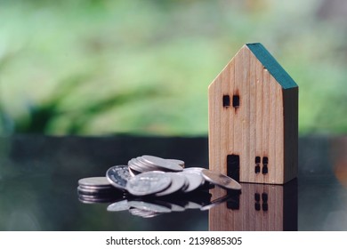 Close Up Toy Wood House And Stack Of Coin On Table, Saving And Manage Money For Building, Home Insurance Business Technology, Subprime Mortgage Crisis Risk And Problem Concept