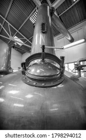 Close Up Of A Traditional Copper Whisky Still, With A Closed Access Hatch, Black And White Image