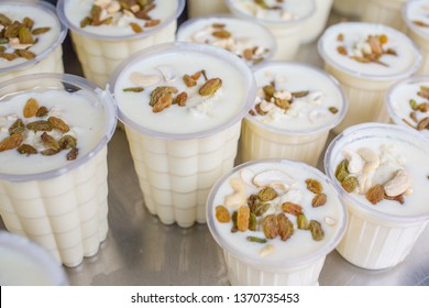 Close Up Of The Traditional Indian Yogurt Drink, Lassi, In Variable Cup Sizes At A Market Stall