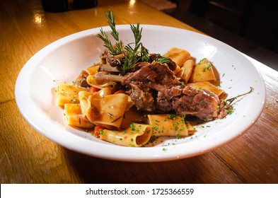 Close Up Of Traditional Italian Dish, Paccheri Pasta With Slow Cooked Pork Short Ribs, Eating In A Fine Dining Italian Restaurant, Cool Ambience, Sharing With Loved Ones