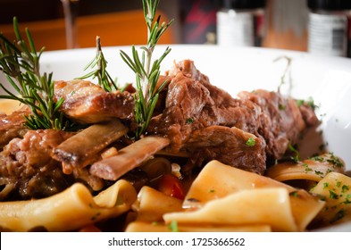 Close Up Of Traditional Italian Dish, Paccheri Pasta With Slow Cooked Pork Short Ribs, Eating In A Fine Dining Italian Restaurant, Cool Ambience, Sharing With Loved Ones