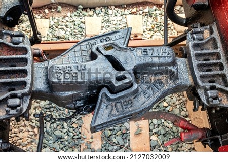Close up of a train car coupler joint. Train car coupler joint trains and industry container railroad