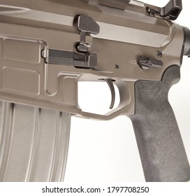 Close Up Of Trigger On An AR 15 Style Rifle, With A Magazine Inserted.