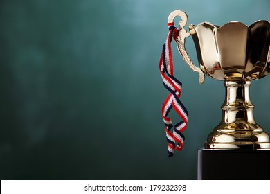 close up of the trophy in front of chalkboard - Powered by Shutterstock