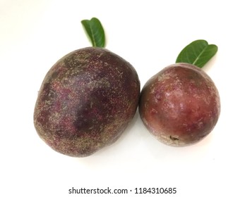 Close Up Of Tropical Passion Fruits (purple Granadilla) In White Background