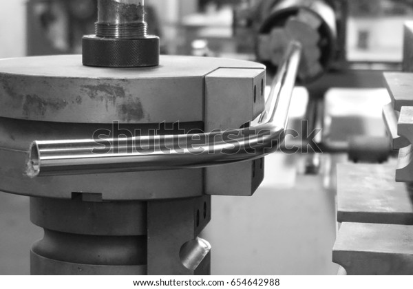 close up tube\
bending machine in the\
factory