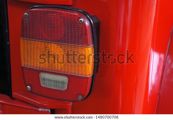  Close up of a turn signal lamp\
and brake lamp of a retro car                             \
