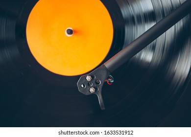 Close up of turntable tonearm play vinyl record